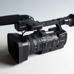 Photograph of a Sony NX5U video camera on a grey gradient background.