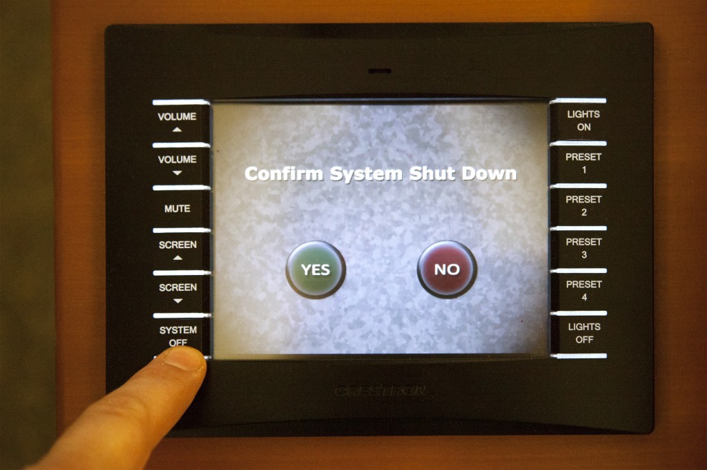 Closeup of the touch control panel with Confirm System Shutdown screen visible.