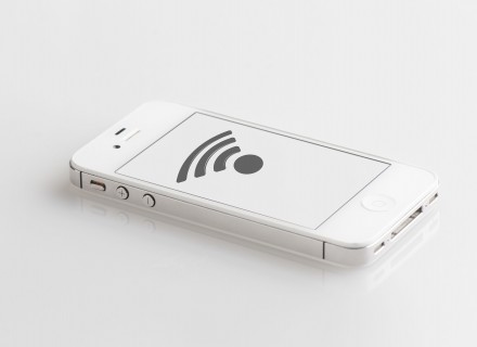 White iphone with WIFI logo displayed on the screen