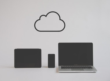 Picture of computers with a cloud icon above